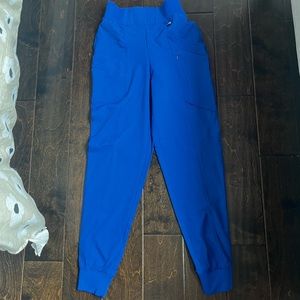 A bright blue size extra small scrub pants. Never been worn!